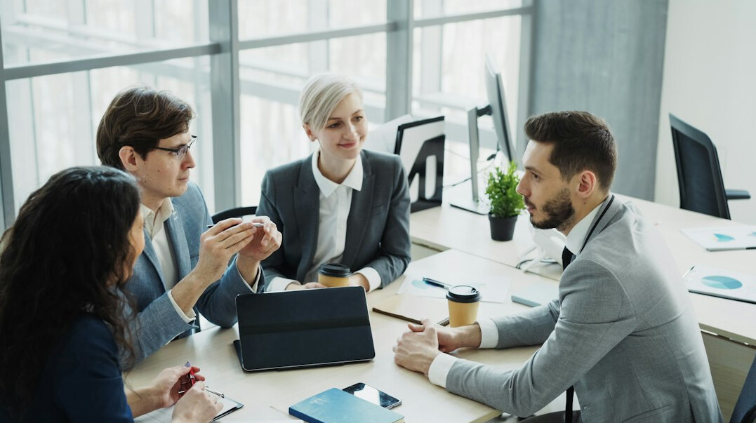 business team discussing software